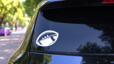 One-Color Modern Football At An Angle on a Rear Car Window (New) example