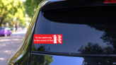 Only In Event Of Fire Sign Sticker on a Rear Car Window (New) example