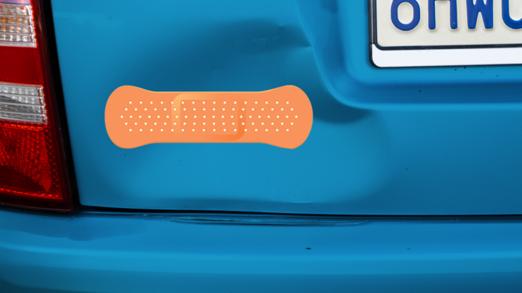 Orange Band Aid Bandage Sticker on a Dented Car example