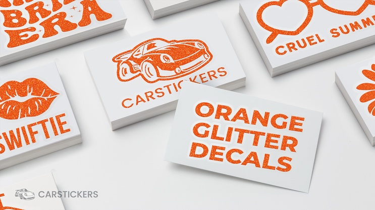 Taylor Swift themed orange glitter transfer decal stacks on tables.