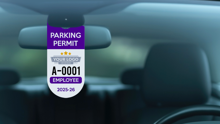 Oval hang tag parking permits hanging from rear view mirror