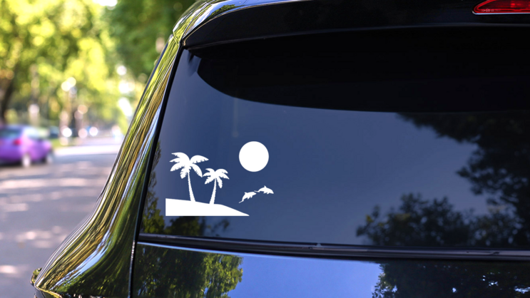 Palm Trees Beach Scene With Dolphins Sticker on a Rear Car Window (New) example