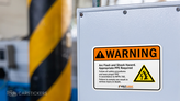 Permanent warning sticker applied to electrical box.