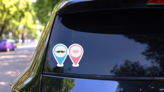 Pink and Blue Male and Female Symbol Stickers on a Rear Car Window (New) example