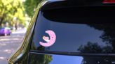 Pink Cute Moon Holding Baby Yellow Star Sticker on a Rear Car Window (New) example