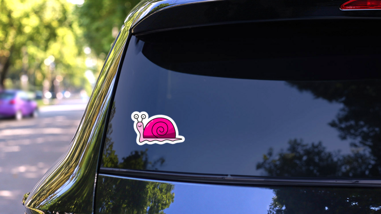Pink Smile Snail Sticker on a Rear Car Window (New) example