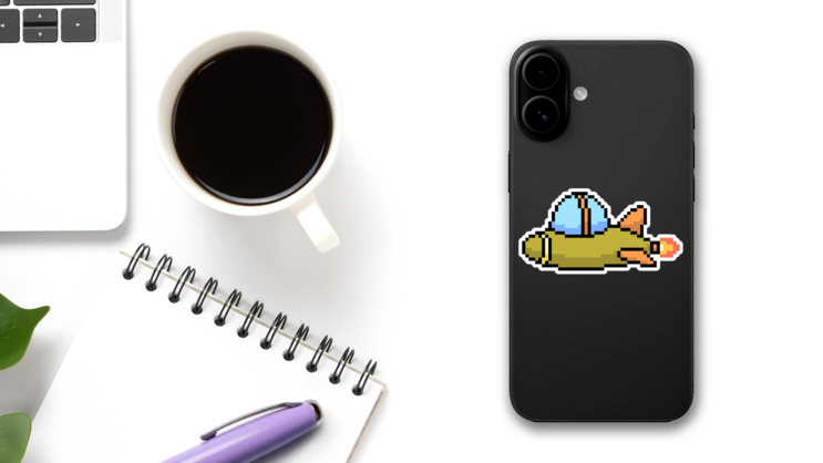 Pixel Art Cartoon Spaceship Sticker on a Phone (New) example