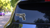Pixel Art Gun Sticker on a Rear Car Window (New) example