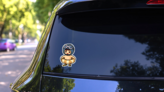 Pixel Art Kid At Beach Sticker on a Rear Car Window (New) example