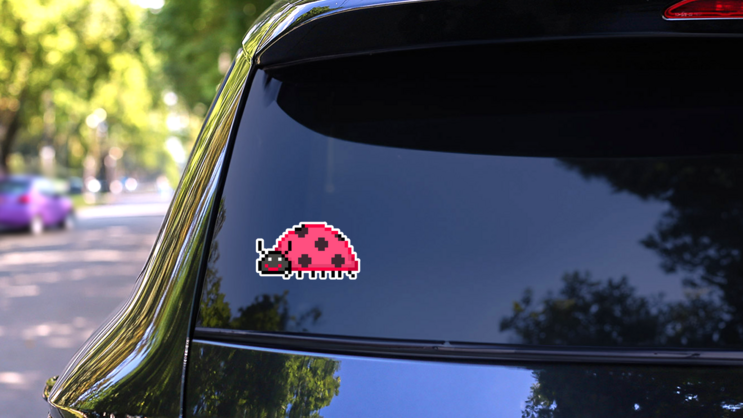 Pixel Ladybug Sticker on a Rear Car Window (New) example
