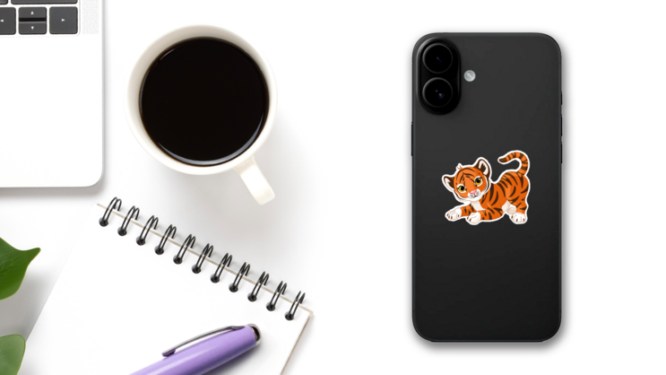 Playful Tiger Cub Sticker on a Phone (New) example