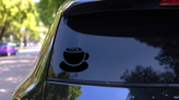 Plump Coffee Cup Swirl Sticker on a Rear Car Window (New) example