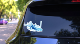 Polygonal Illustration Of Woman Slalom Skiing Sticker on a Rear Car Window (New) example