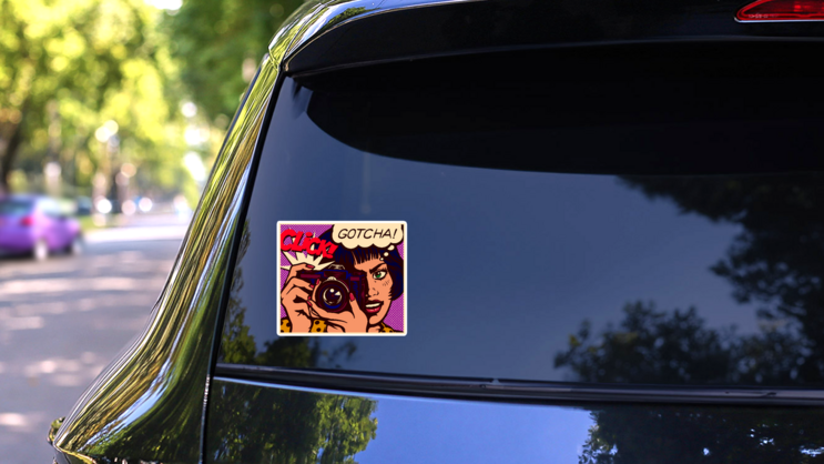 Pop Art Comic Book Style Photographer Gotcha! Sticker on a Rear Car Window (New) example