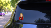 Pop Art Woman & Coffee Sticker on a Rear Car Window (New) example