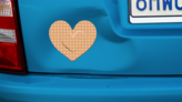 Pretty Heart Band Aid Bandage Sticker on a Dented Car example