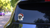 Pug Wearing A Santa Hat Smile Sticker on a Rear Car Window (New) example