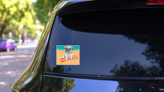 Puppy Pug On A Beach Sticker on a Rear Car Window (New) example