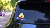 Purple Alien Spaceship Sticker on a Rear Car Window (New) example