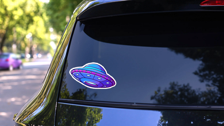 Purple Alien UFO Sticker on a Rear Car Window (New) example