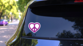 Purple Peace Sign Heart Sticker on a Rear Car Window (New) example