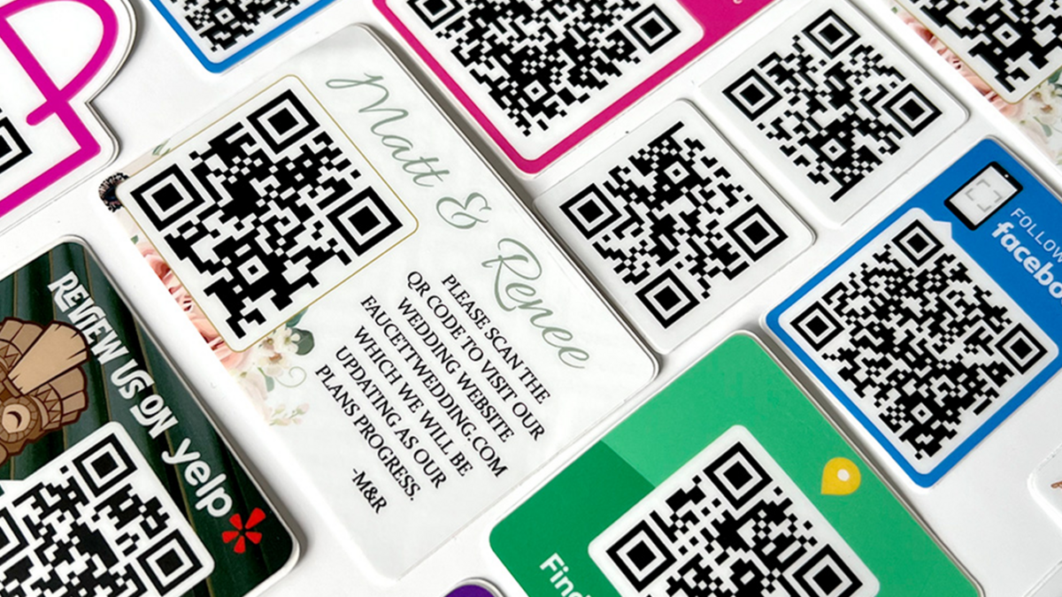 Custom QR Code Stickers in Stacks on a Table