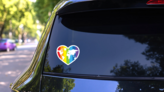 Rainbow Heart With A Map Of The World Pride Sticker on a Rear Car Window (New) example