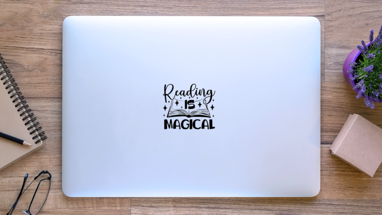 Reading Is Magical Book Lettering Sticker on a Laptop (New) example