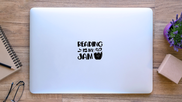 Reading Is My Jam Book Lettering Sticker on a Laptop (New) example