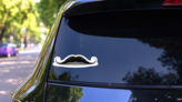 Realistic Vintage Black Curly Mustache Sticker on a Rear Car Window (New) example
