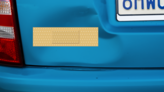 Rectangular Band Aid Bandage Sticker on a Dented Car example