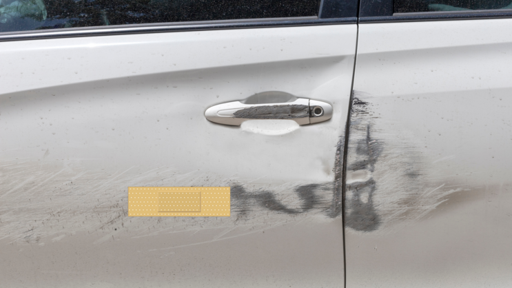 Rectangular Band Aid Bandage Sticker on a Scratched Car example