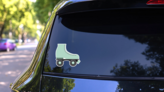 Retro Rollerblade Sticker on a Rear Car Window (New) example