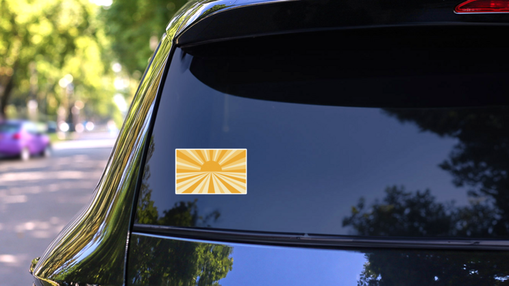 Retro Yellow Sunshine Graphic Sticker on a Rear Car Window (New) example