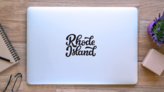 Rhode Island Calligraphy Sticker on a Laptop (New) example