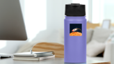Rocket Flying Over the Moon Sticker on a Water Bottle (New) example