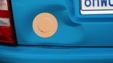 Round Band Aid Bandage Sticker on a Dented Car example
