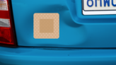 Rounded Corner Bandage Sticker on a Dented Car example
