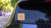 Rounded Corner Bandage Sticker on a Rear Car Window (New) example
