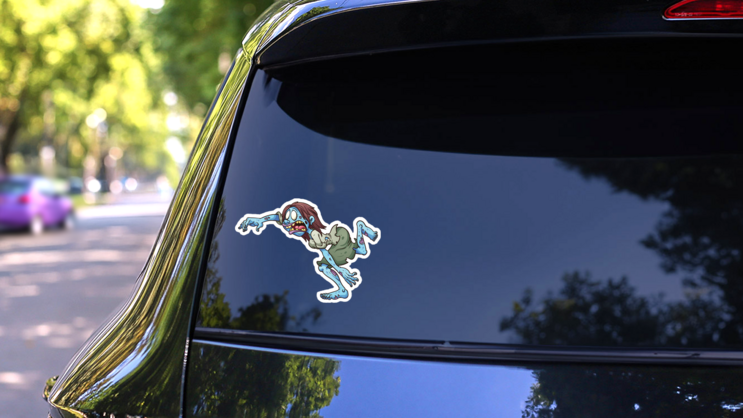 Running Cartoon Zombie Woman Sticker on a Rear Car Window (New) example