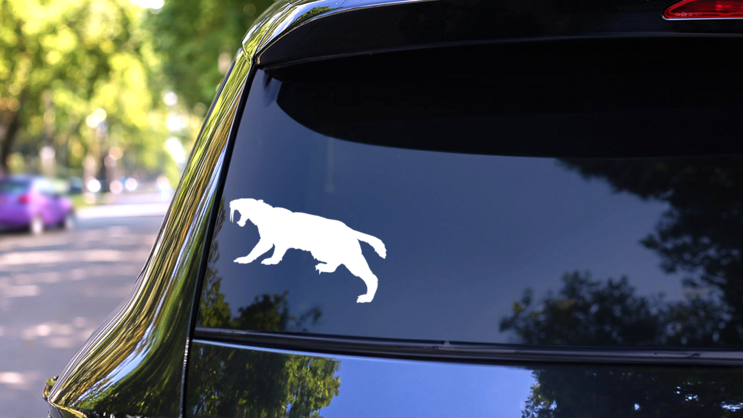 Saber Toothed Tiger Stalking Prey Sticker on a Rear Car Window (New) example