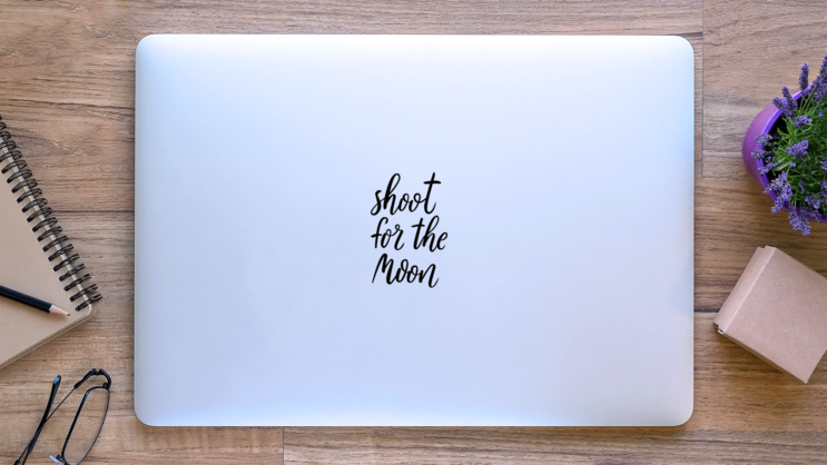 Shoot For The Moon Typography Sticker on a Laptop (New) example
