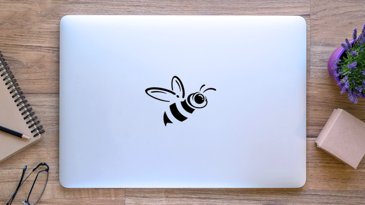 Sideways Bee Icon Sticker on a Laptop (New) example