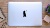 Silhouette Of A Girl Archer With Long Hair Sticker on a Laptop (New) example