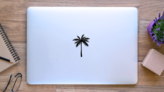 Silhouette Of A Single Palm Tree Sticker on a Laptop (New) example