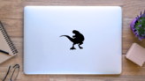 Silhouette T Rex Dinosaur Sticker on a Laptop (New) example