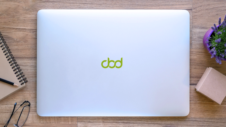 Simple Letter Cbd Logo Sticker on a Laptop (New) example