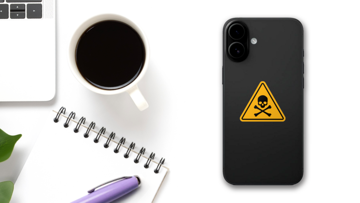 Skull And Crossbones Warning Sign Sticker on a Phone (New) example