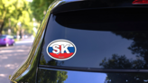 Slovakia Sk Flag Oval Sticker on a Rear Car Window (New) example