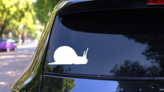 Snail With Long Antennas Sticker on a Rear Car Window (New) example